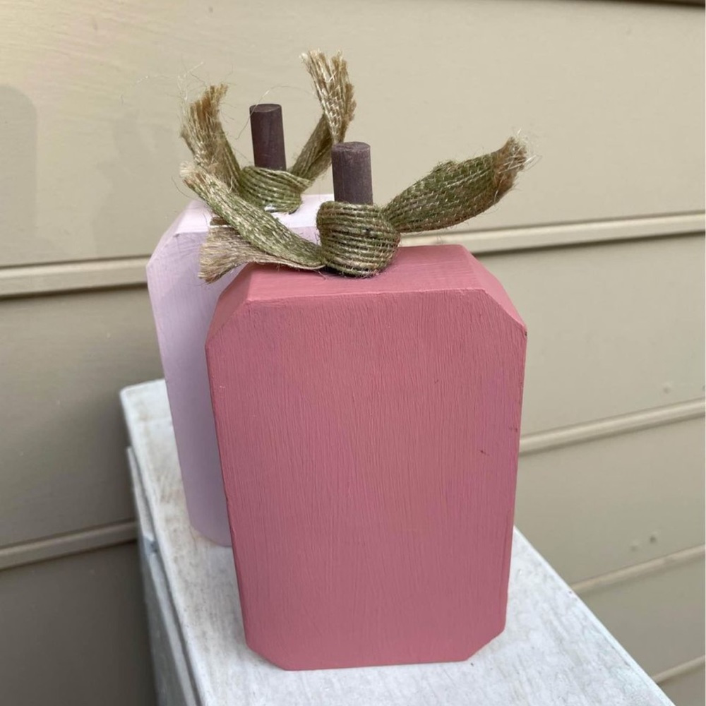 Blush, coral, and ivory hand painted pumpkins used for wedding decor.